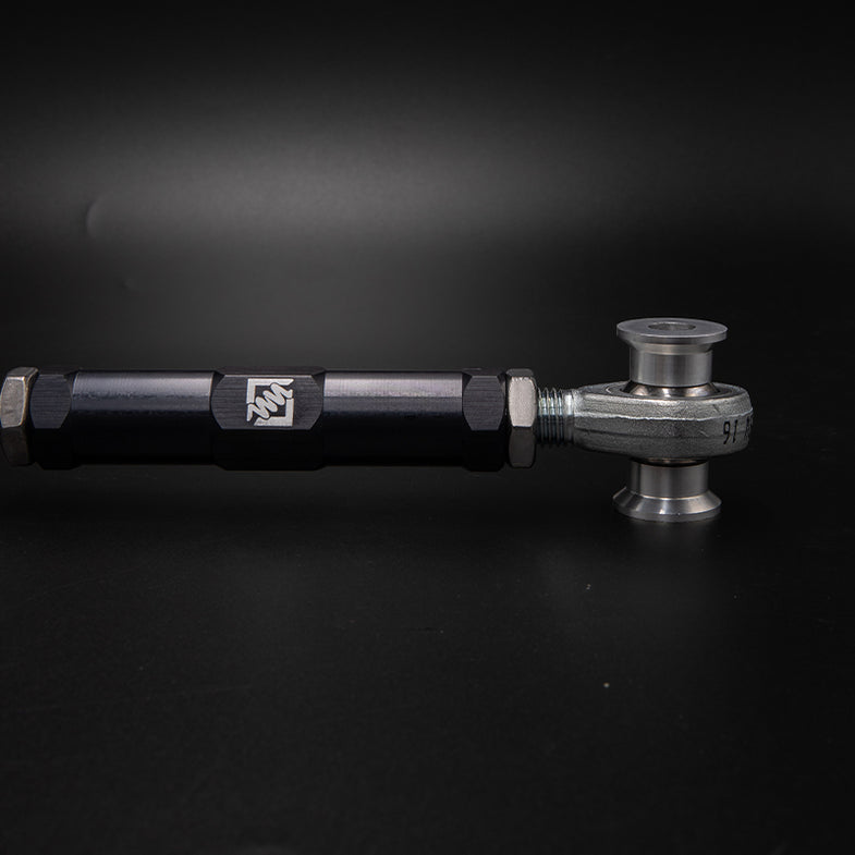 Suspension Secrets adjustable rear camber arms for BMW F20 M135I/M140I, showing the kinematics kit with metal components on a white background.