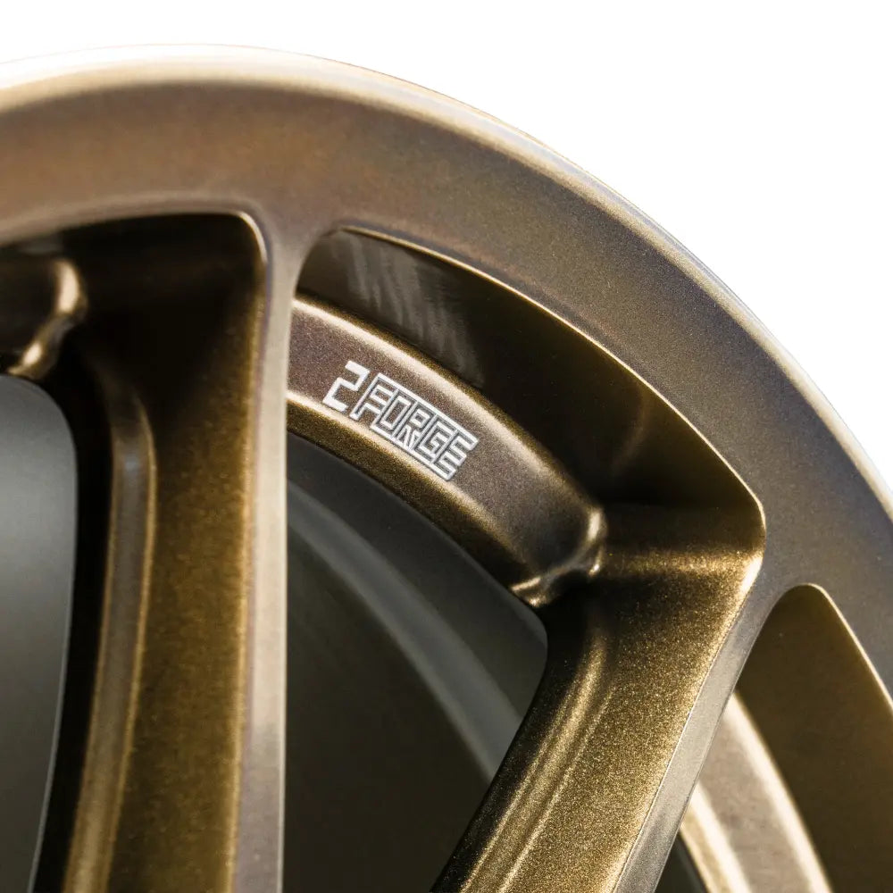 Close-up of 2Forge ZF8 semi-forged wheels showcasing the detailed alloy wheel design and finish.