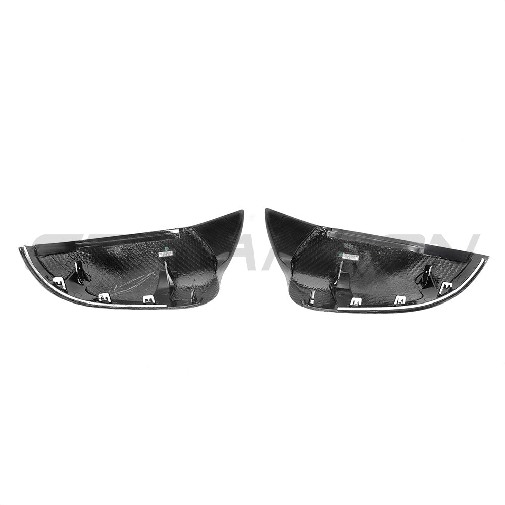 BMW X5/X6 F15/16 carbon fibre mirrors by CT Carbon, close-up of sleek, lightweight side mirrors with carbon fiber finish.