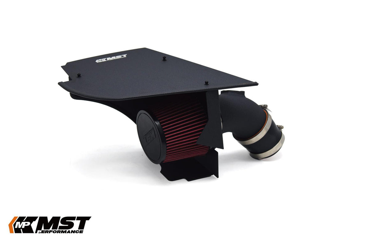 MST Performance induction kit installed in a BMW B58 540i engine bay showing air intake components and hoses.