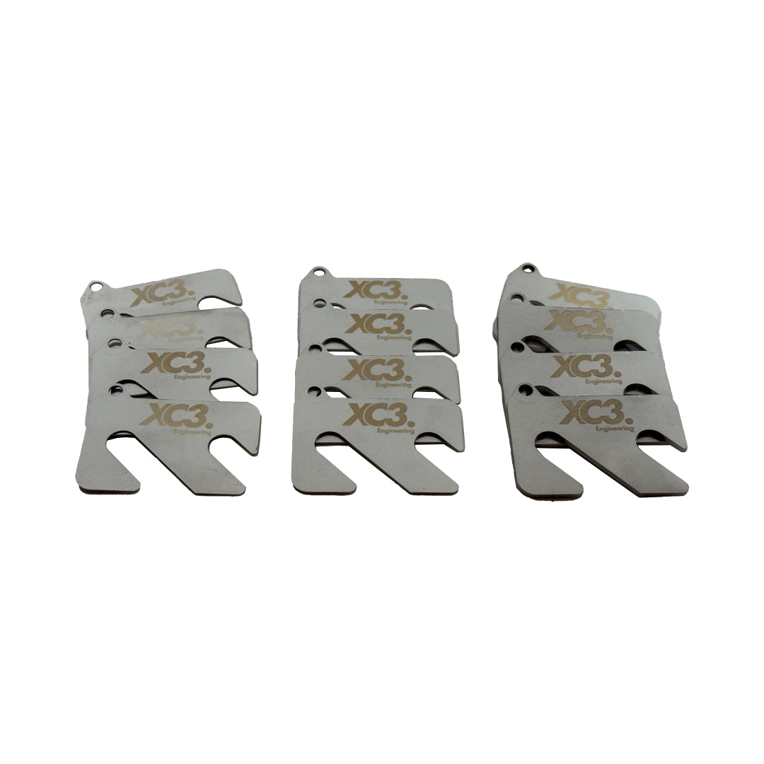 Porsche 911 997 GT3 GT3 RS front camber shim kit by XC3 Engineering showing metal shims for suspension alignment.