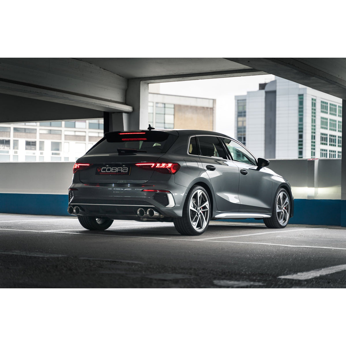 Cobra Sport Audi S3 8Y 5-door Sportback GPF back performance exhaust system showing polished metal tips and exhaust pipe details.