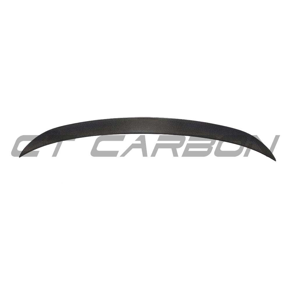 BMW M3 G80 G20 wet carbon fiber spoiler by CT Carbon, OEM-style, showing sleek, glossy carbon fiber surface on the car's rear.