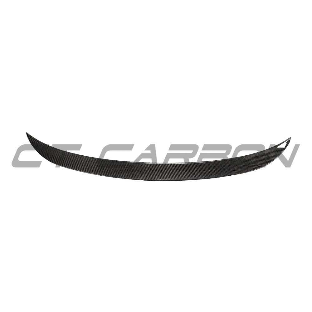 BMW M3 G80 G20 CT Carbon wet carbon fiber spoiler in OEM style, showcasing a sleek, aerodynamic design on a black car.