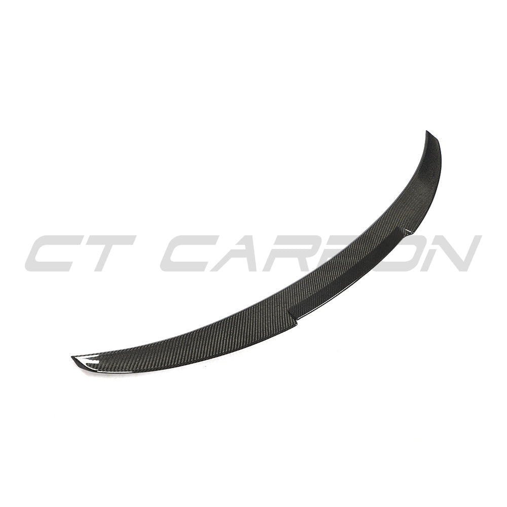 BMW 4 Series G26 and i4 carbon fibre spoiler by CT Carbon, V2 style, mounted on the vehicle's trunk for aerodynamic enhancement.