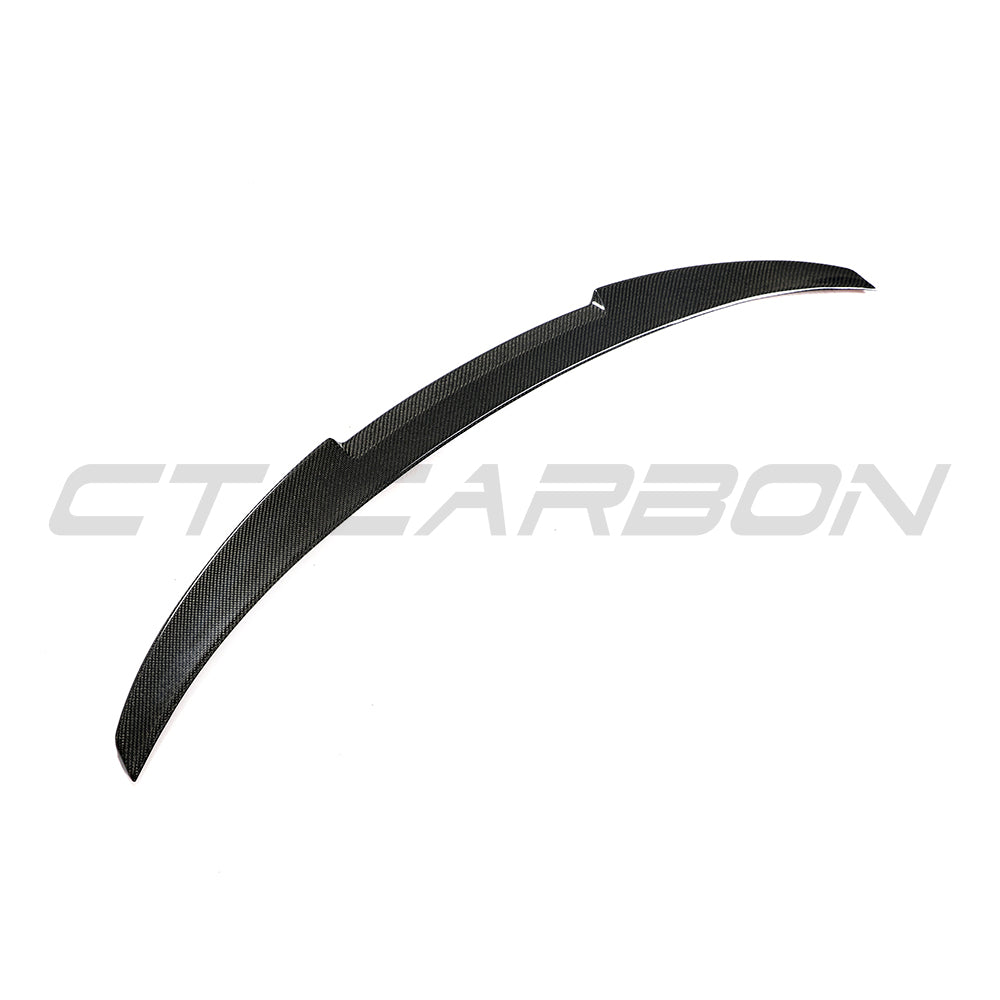 BMW 4 Series G26 and i4 carbon fibre spoiler by CT Carbon, V2 style, showing sleek aerodynamic design on the car's rear.