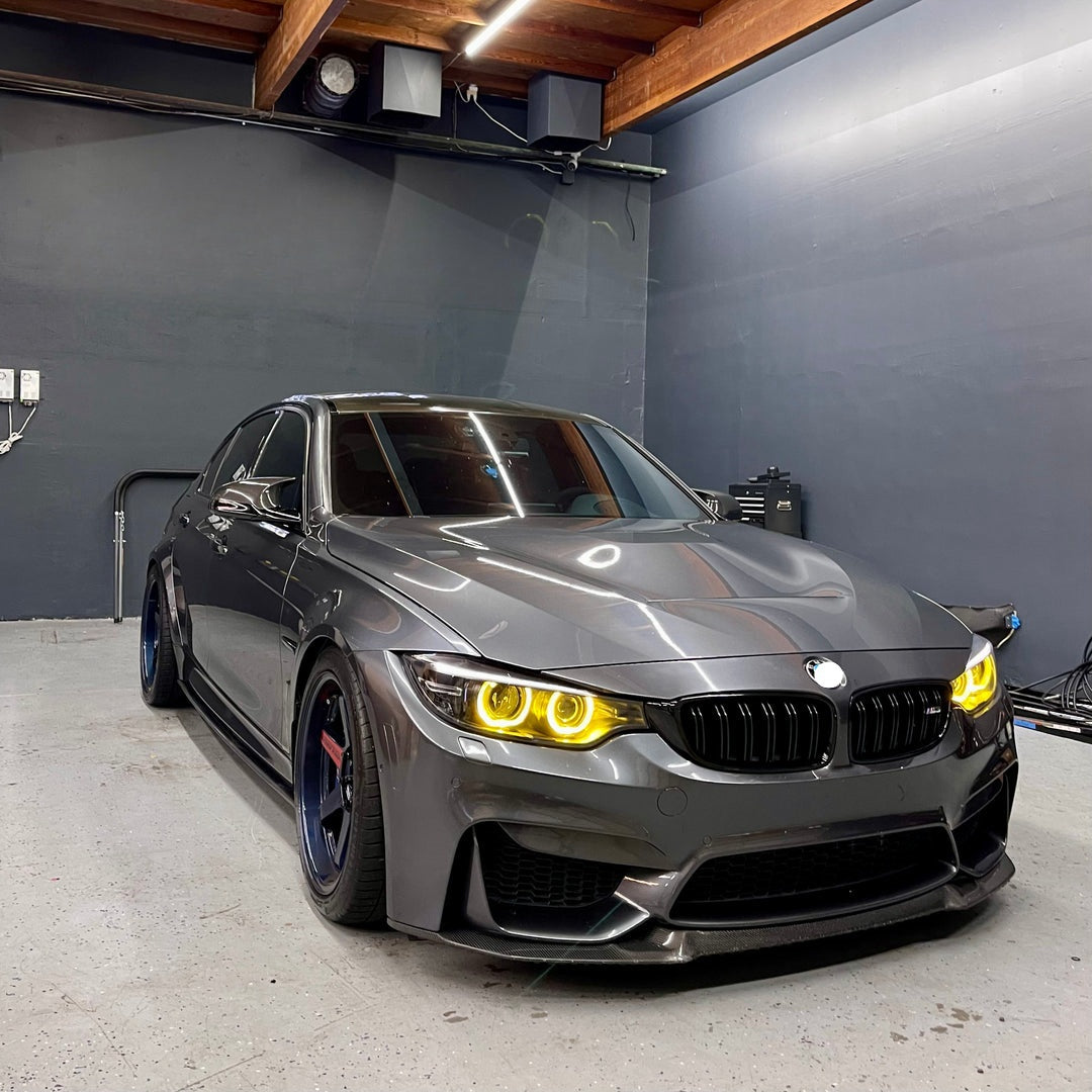 BMW F80/F82 M3 M4 pre-LCI yellow Xenon DRL module set by CT Carbon, showing close-up of the LED daytime running lights.