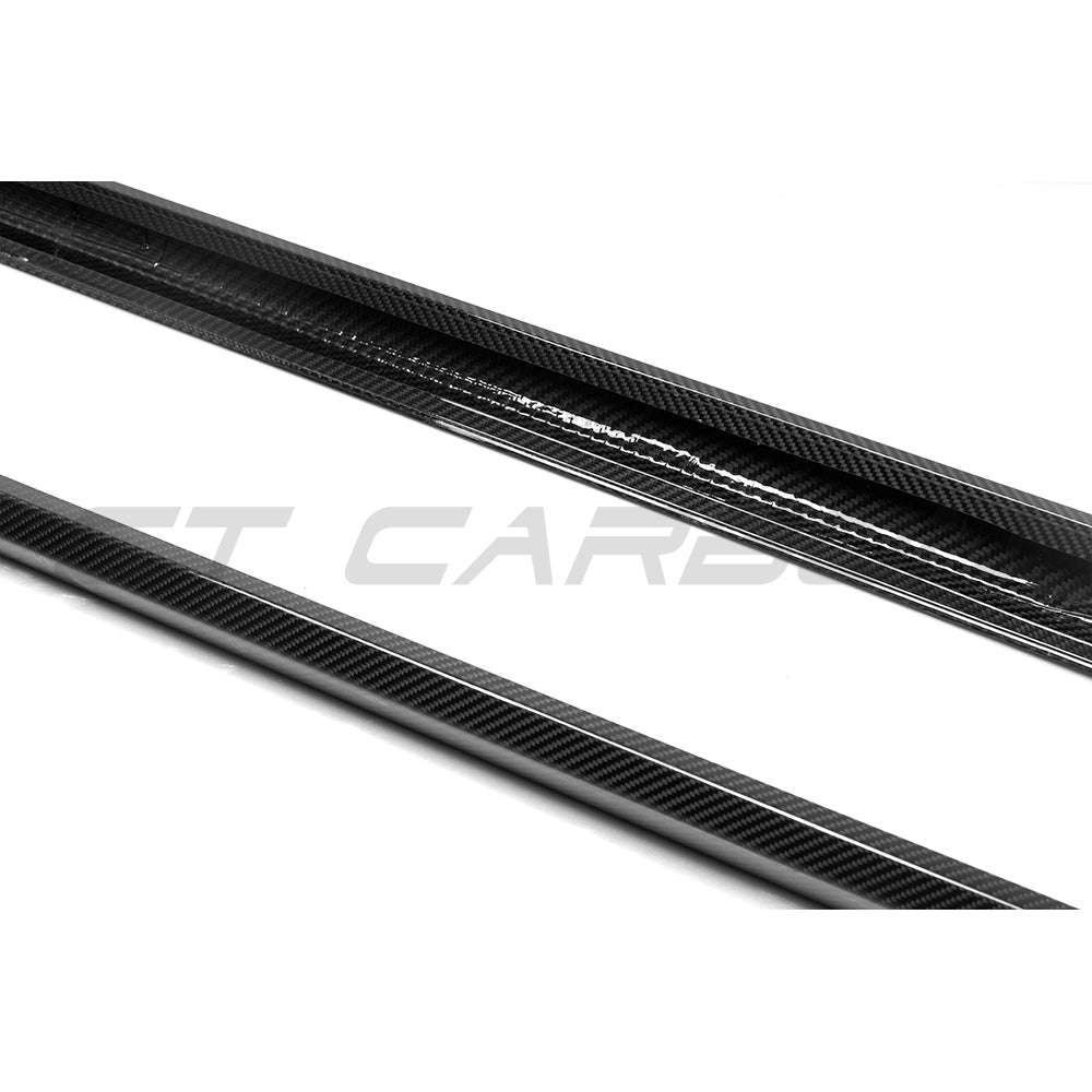 BMW G90 G99 M5 2024 carbon fiber side skirts by CT Carbon, showing sleek, lightweight aerodynamic design on the vehicle.