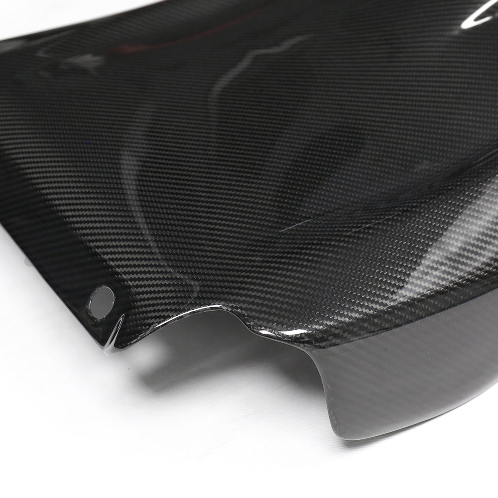 BMW GXX/F9X full carbon fiber seat backs by CT Carbon, showing sleek, lightweight carbon fiber material and detailed craftsmanship.