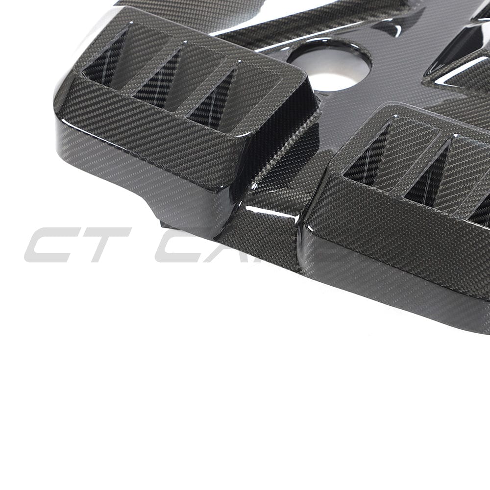 BMW M2 M3 M4 G87 G80 G81 G82 G83 carbon fiber engine cover by CT Carbon, showcasing the sleek, lightweight automotive accessory.