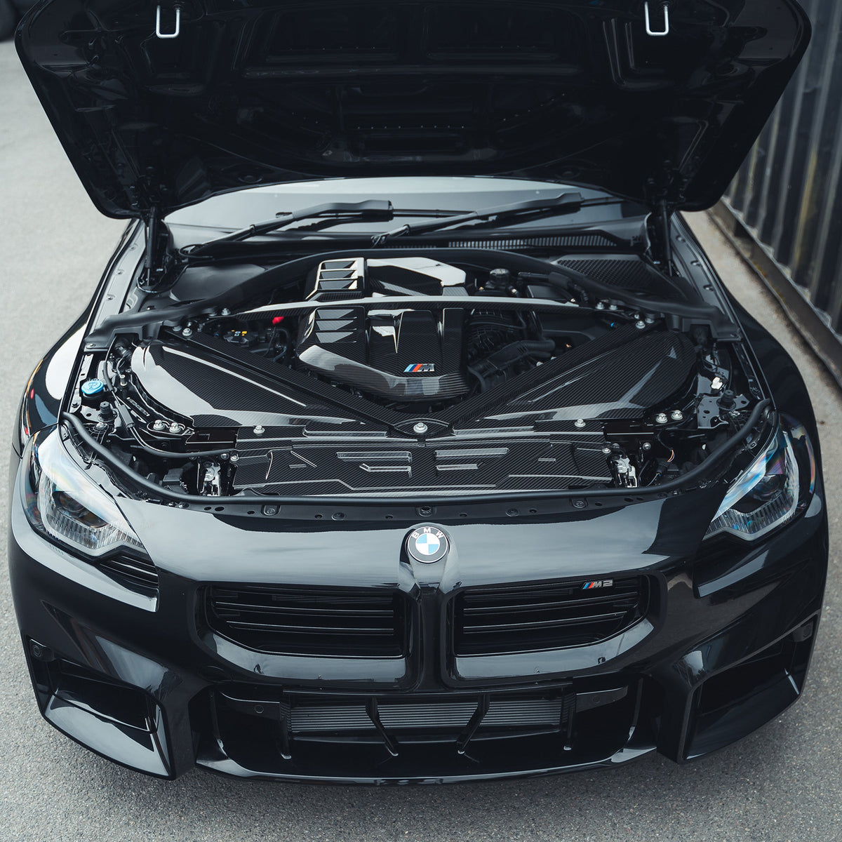 BMW M2 M3 M4 G87 G80 G81 G82 G83 Carbon Fibre Engine Dress Up Kit by CT Carbon, showing sleek carbon fibre engine accents.
