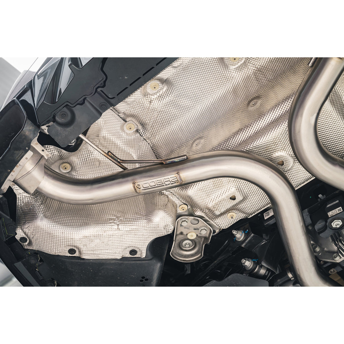 Cobra Sport BMW M240i G42 Venom Race rear axle back exhaust with back box delete installed on the car.