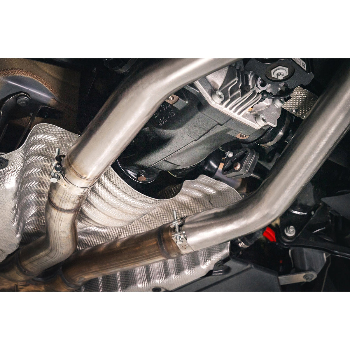 BMW M240i G42 Cobra Sport Venom Race rear axle back performance exhaust installed, showcasing the back box delete design.