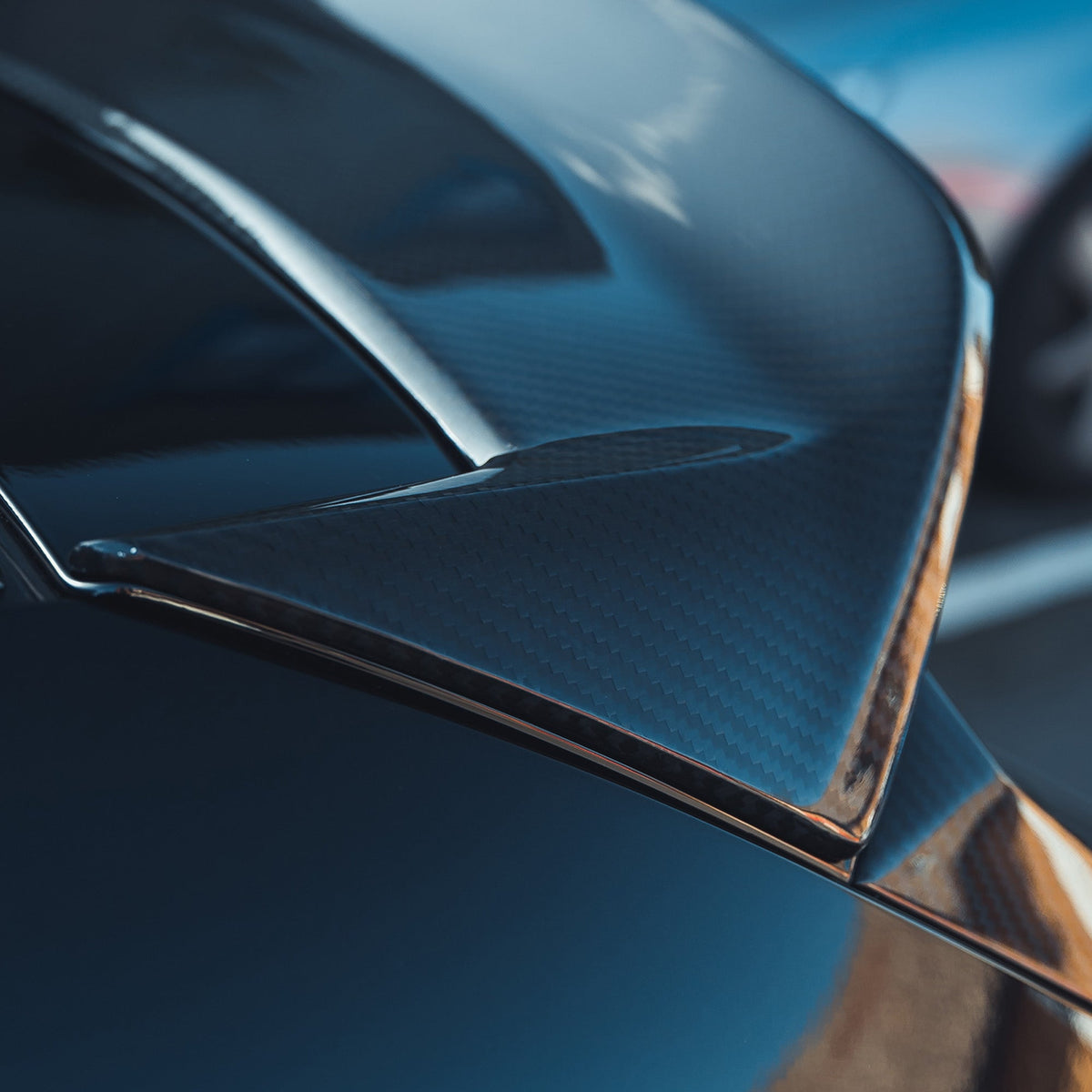 BMW M3 G81 G21 carbon fiber spoiler by CT Design, showcasing sleek aerodynamic design on the car's rear.