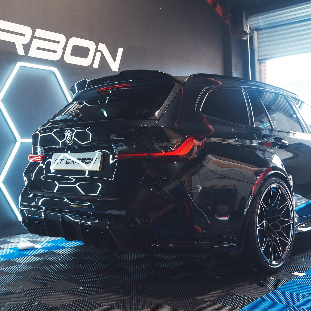 BMW M3 G81 carbon fibre spoiler by CT Carbon, showcasing sleek aerodynamic design on the car's rear.