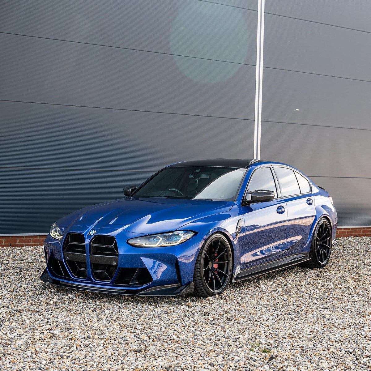BMW M3 and M4 G80 G82 carbon fibre splitter by CT Carbon, front view showing sleek aerodynamic design.