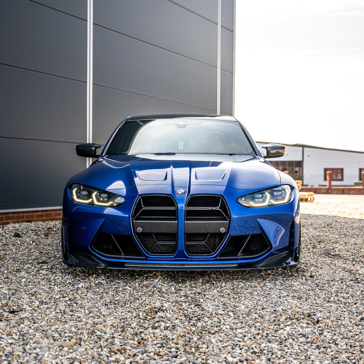 BMW M3 and M4 G80 G81 G82 G83 carbon fibre splitter by CT Carbon, showcasing its lightweight, aerodynamic design.