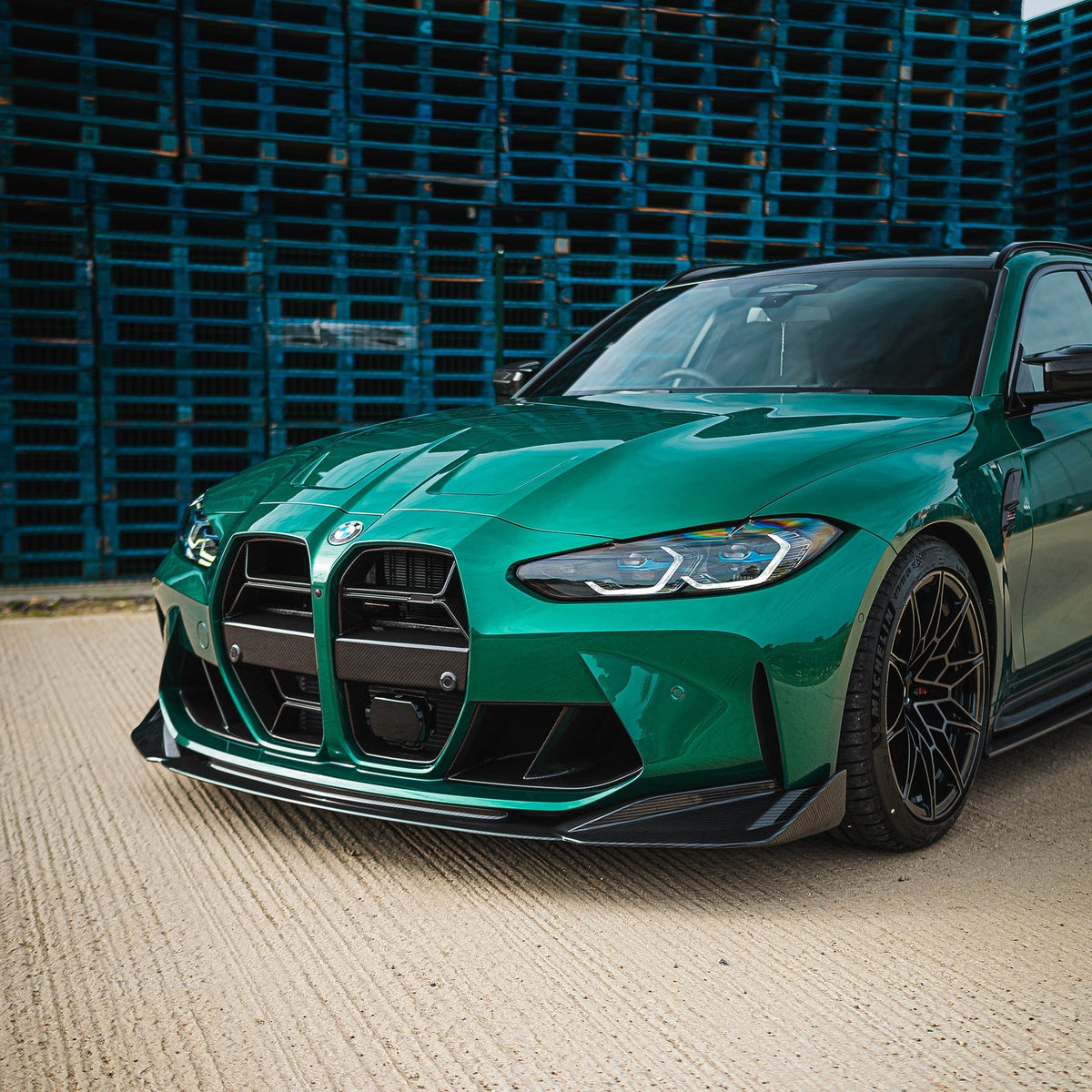 BMW M3 and M4 G80 G82 G81 G83 carbon fibre splitter by CT Carbon, showcasing its sleek, lightweight design for high-performance cars.