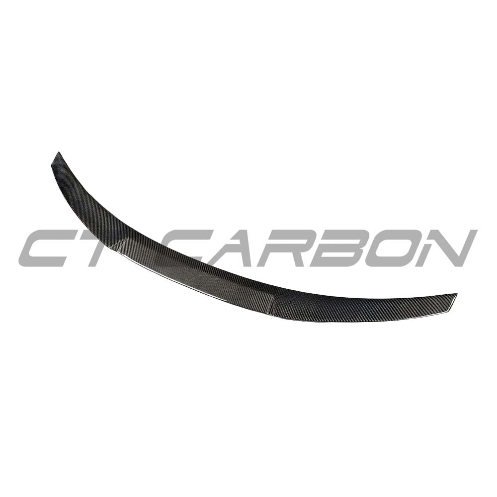 BMW M3 G80 G20 CT Carbon wet carbon fiber spoiler V3 installed on the rear of the sports car for enhanced aerodynamics.