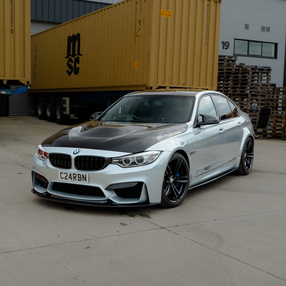 BMW M3 M4 F80 F82 F83 2014-2020 CT Carbon pre-preg carbon fibre side skirts installed on the vehicle.