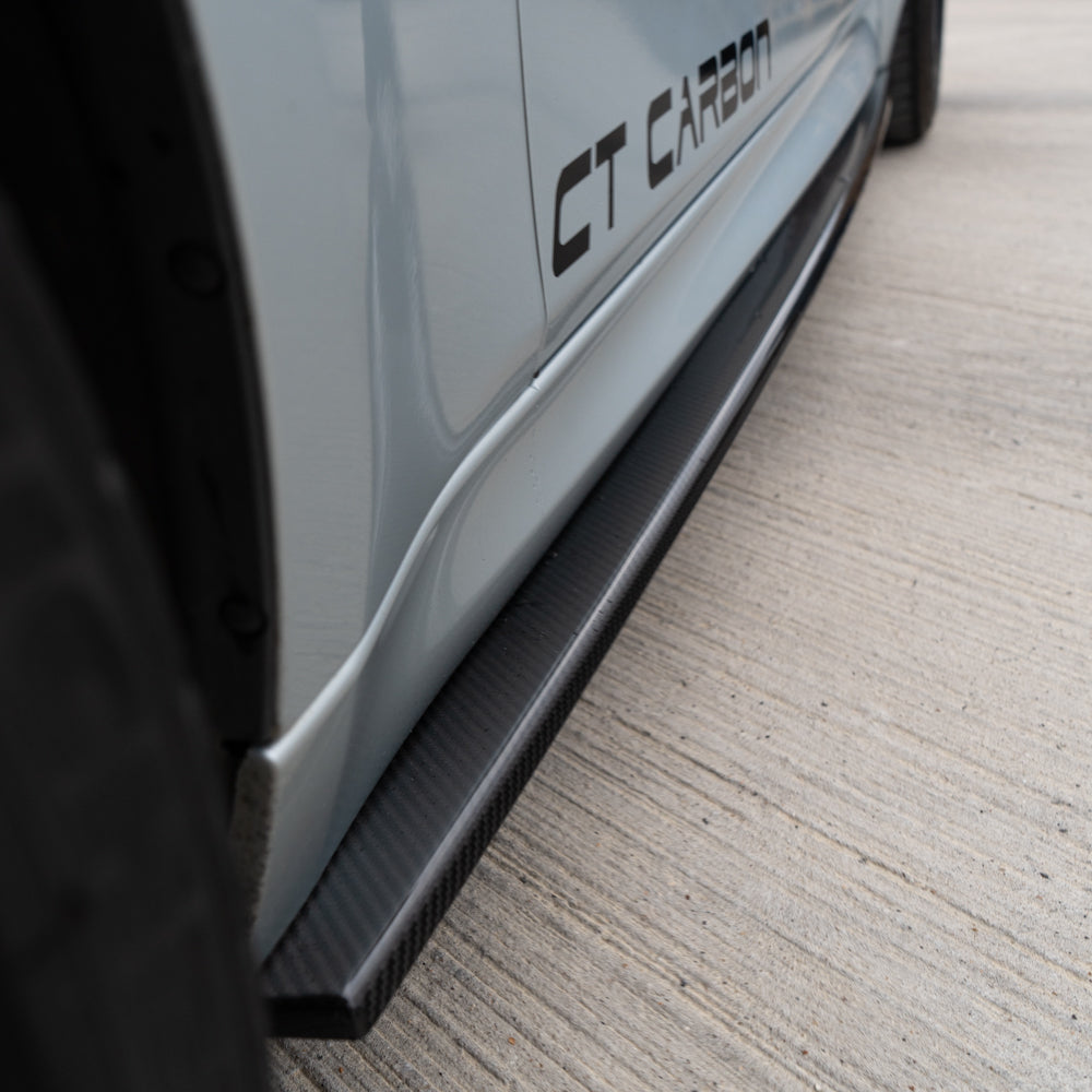 BMW M3 M4 F80 F82 F83 side skirts by CT Carbon, made from pre-preg carbon fiber, shown installed on the car.