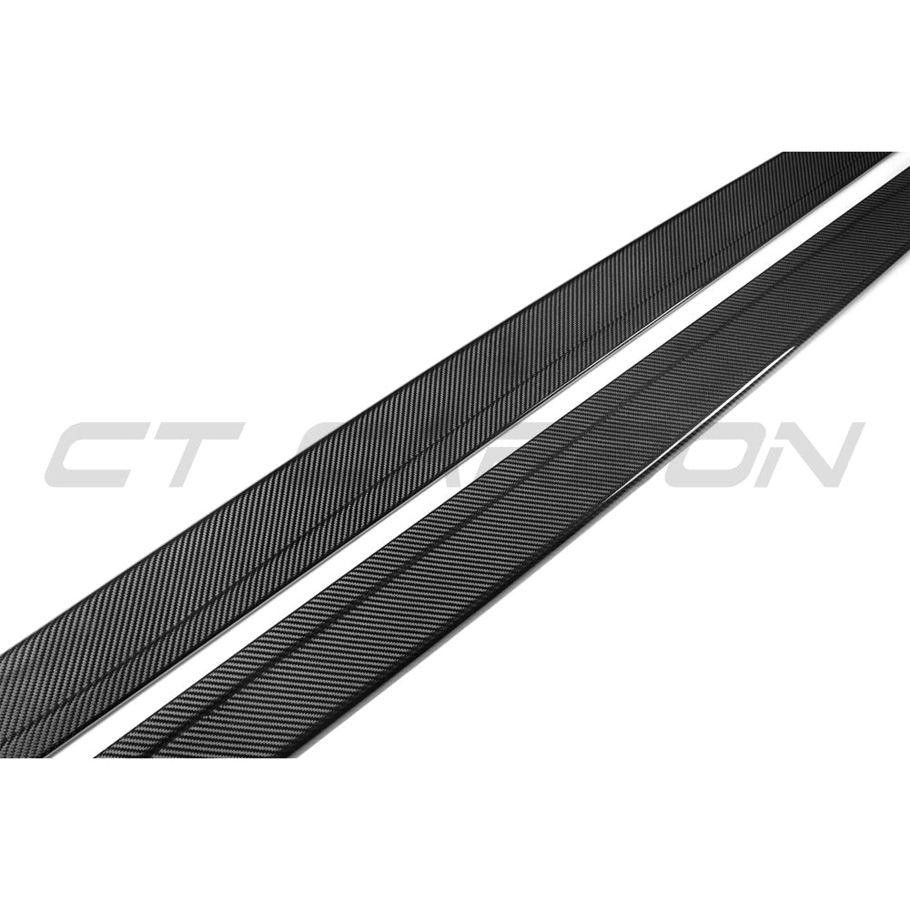 BMW M3 M4 F80 F82 F83 side skirts by CT Carbon, made from pre-preg carbon fiber, installed on the car's side profile.