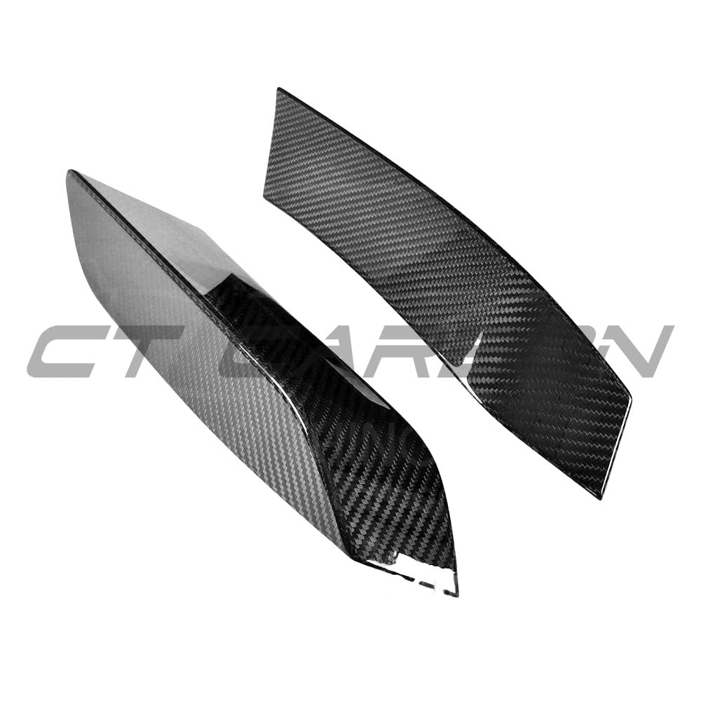 BMW M3 M4 F80 F82 F83 carbon fiber upper front canards, automotive accessories by CT Carbon, shown on a sporty car.
