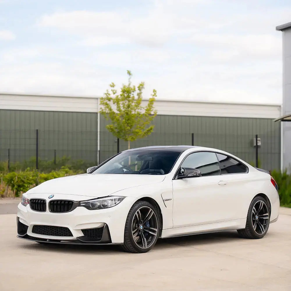 BMW M3 M4 F80 F82 F83 carbon fiber splitter set by CT Carbon, featuring three-piece front grille splitters in carbon fiber.