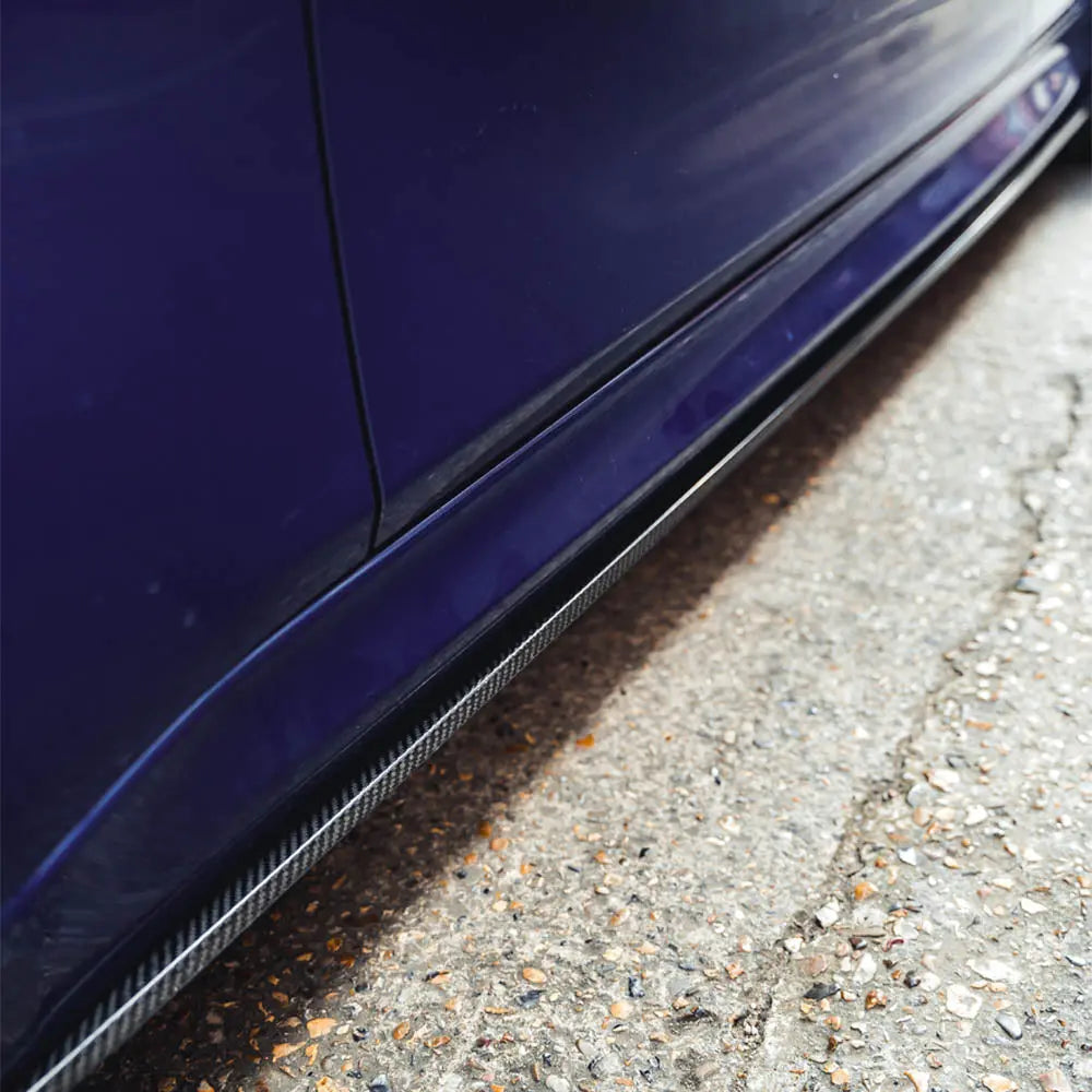 BMW M3 M4 F80 F82 F83 carbon fibre side skirts by CT Carbon, featuring sleek MP style design for a sporty look.