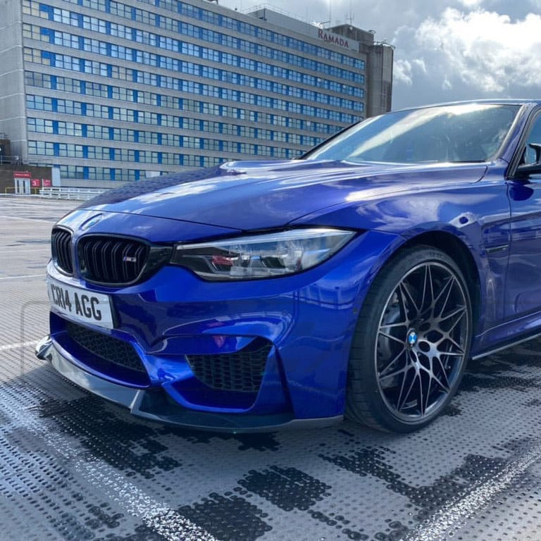 BMW M3 M4 F80 F82 F83 carbon fiber splitter by CT Carbon, V2 style, showing the sleek, aerodynamic design on the vehicle.