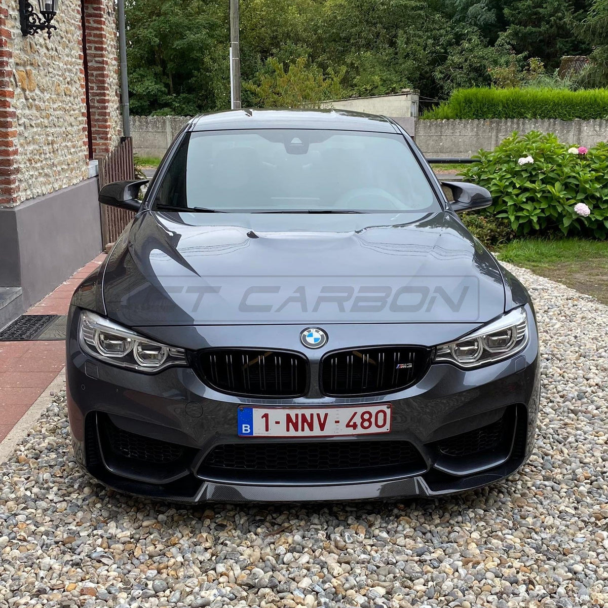 BMW M3 M4 F80 F82 F83 carbon fiber splitter by CT Carbon, V2, showcasing sleek aerodynamic design and high-quality craftsmanship.
