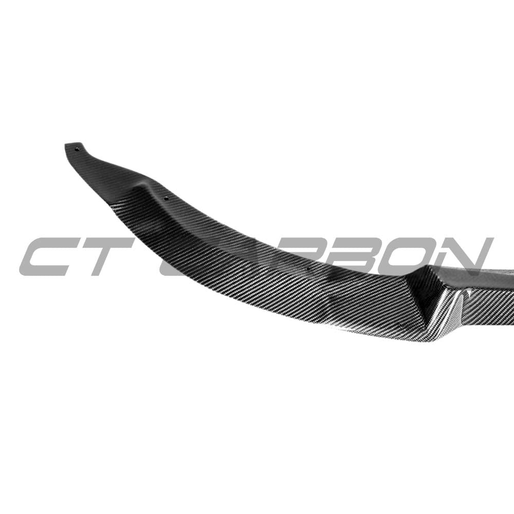 BMW M3 M4 F80 F82 F83 carbon fiber splitter V2 by CT Carbon, showing the sleek, aerodynamic design on the front of the vehicle.