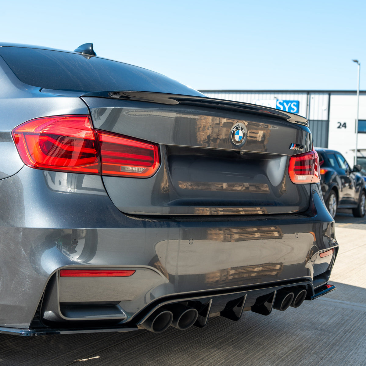 BMW 3 Series F30 GLOSS BLACK spoiler by CT Carbon mounted on a car, showcasing sleek, aerodynamic design and high-quality finish.