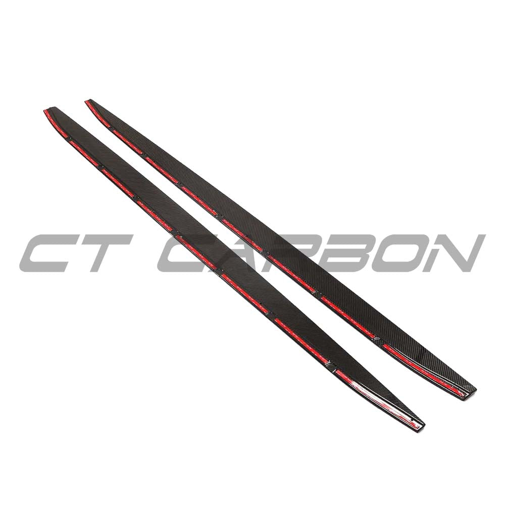 BMW G82 M4 carbon fibre side skirt extensions kit by CT Design, showcasing sleek, lightweight carbon fibre details on the car's side.