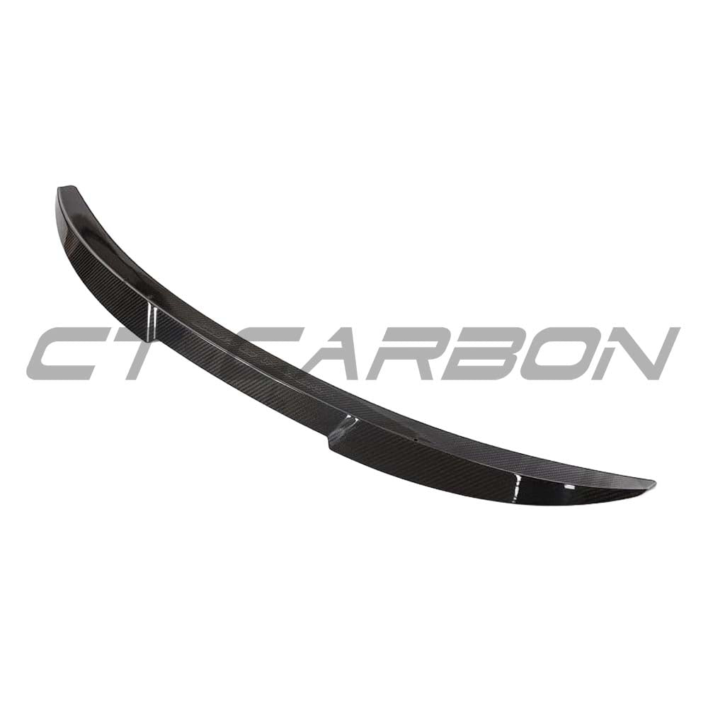 BMW G22 4 Series 2020+ carbon fibre kit from CT Carbon, featuring a sleek carbon fibre spoiler on a sporty car.