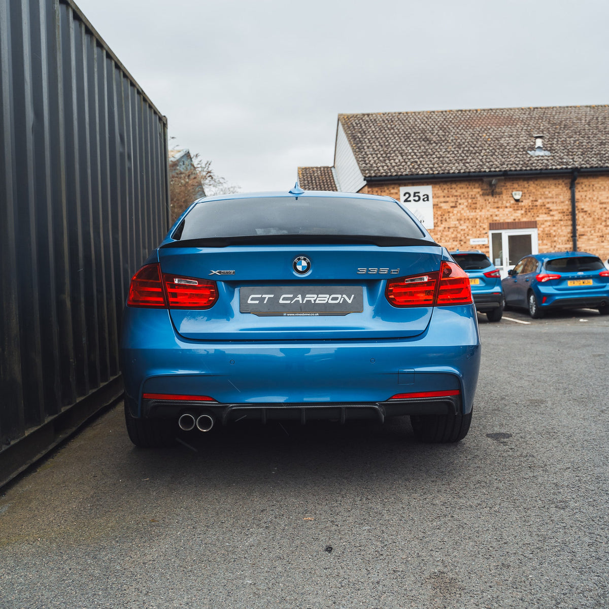 BMW F30 3 Series saloon full carbon fiber kit by CT Carbon, showing the sleek carbon fiber panels on the car's exterior.