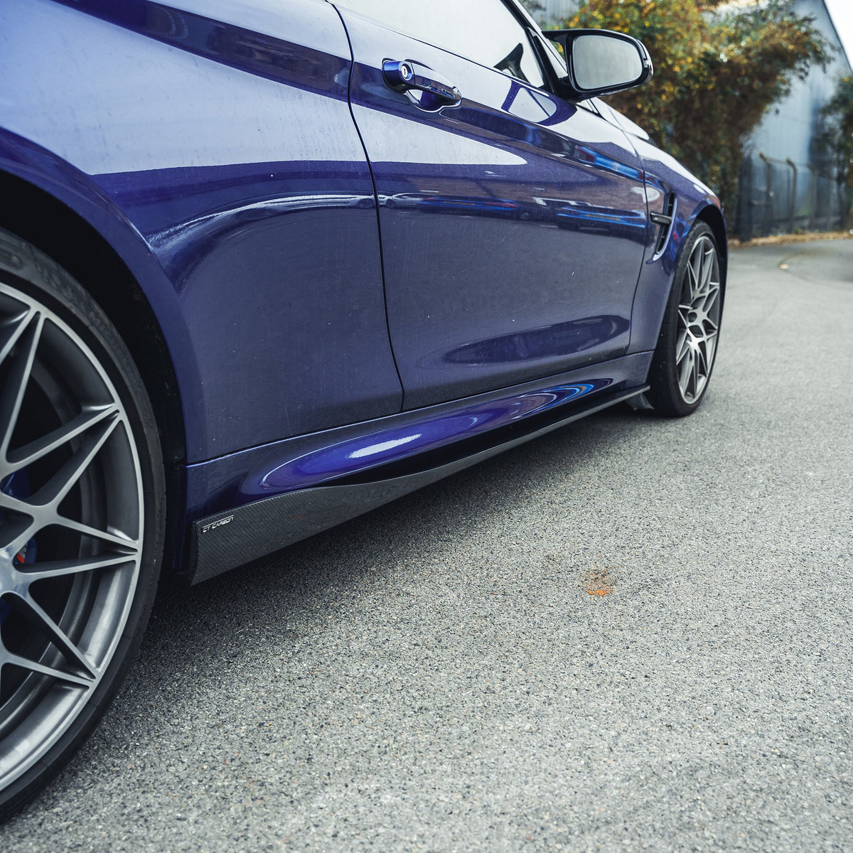BMW M3 M4 F80 F82 F83 carbon fiber side skirts by CT Carbon, showing sleek, lightweight design and detailed craftsmanship.