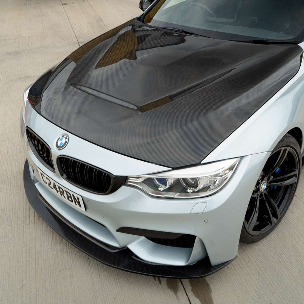 BMW M3 M4 F80 F82 F83 carbon fibre bonnet by CT Carbon, showing the sleek, lightweight hood with carbon fiber weave.