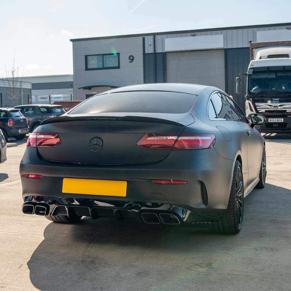 CT Carbon Mercedes C238 2017-2020 E-Class Coupe quad tip diffuser showing sleek black carbon fiber design and exhaust tips.