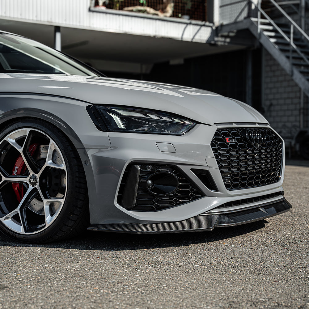 CT Carbon splitters for Audi RS5 B9.5 Sportback and coupe 2020-2025, made of carbon fiber, shown on vehicle front bumper.