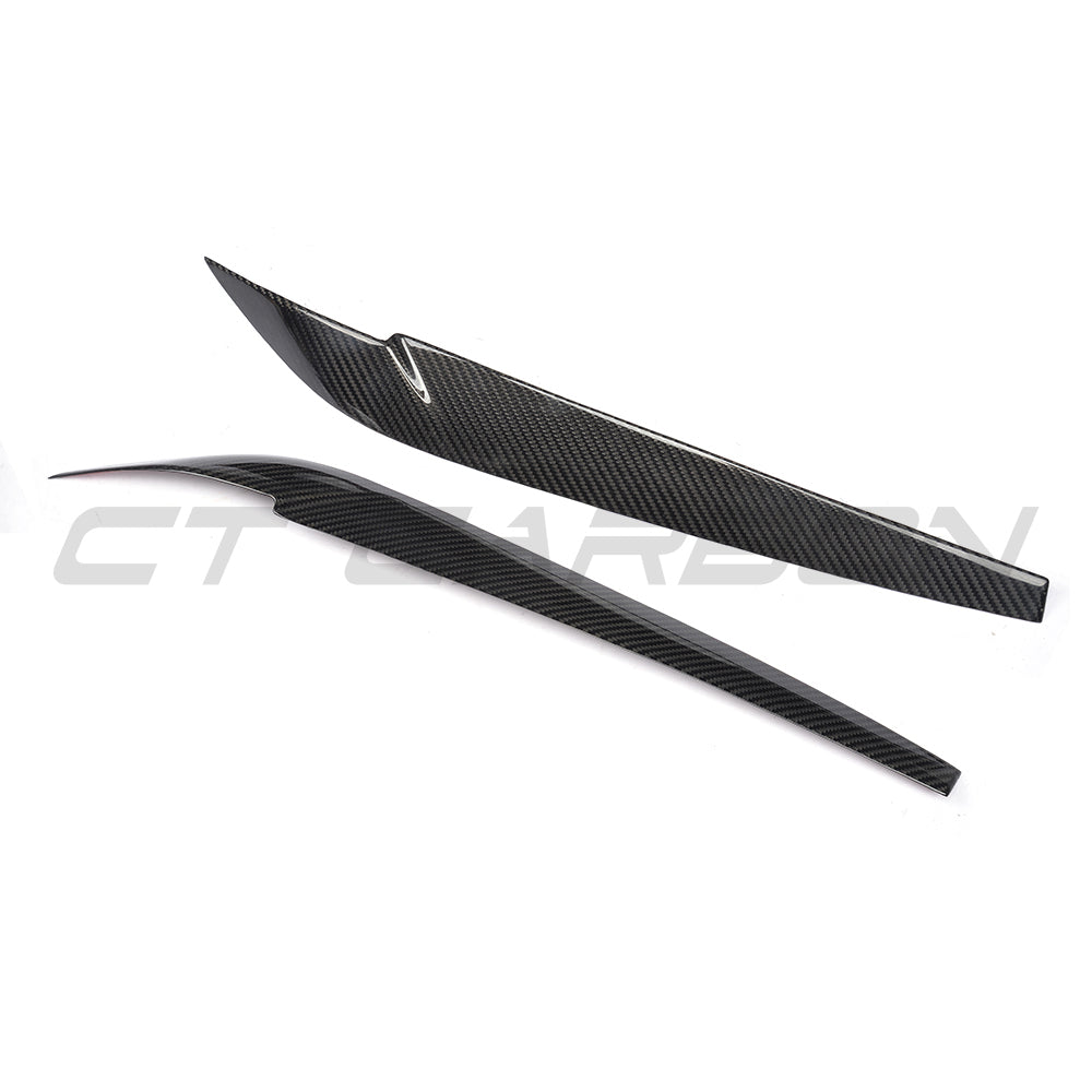 BMW F15/F16 X5/X6 2014-2018 Carbon Fiber Headlight Eyebrows by CT Carbon, close-up view showing sleek black finish and fitment details.