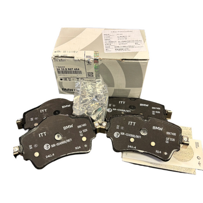 Genuine BMW MINI front brake pads, model 34108867484, showing new brake pad set with metal backing plates and friction material.
