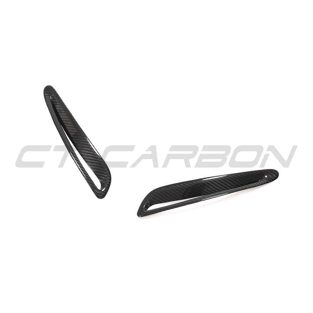 Toyota Supra 2019+ A90 carbon fiber hood trim by CT Carbon, close-up view of lightweight, textured carbon fiber accessory.