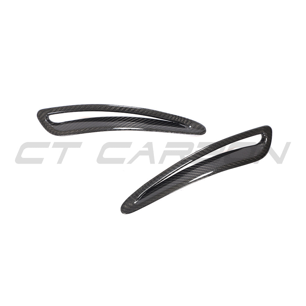 Toyota Supra 2019+ A90 carbon fiber hood trim by CT Carbon, close-up of lightweight, textured automotive accessory.