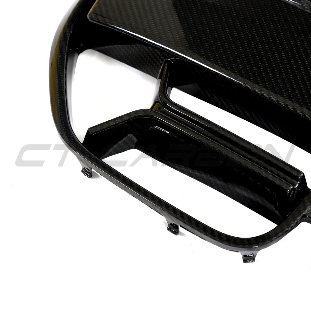BMW 4 Series G22/G23 carbon fiber CSL grille by CT Carbon, front view showing textured black finish without accents.