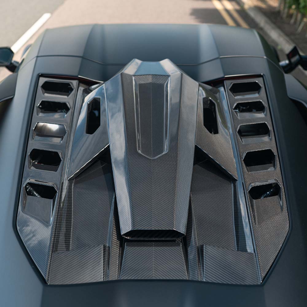 Lamborghini Revetto carbon fibre roof scoop and engine cover by CT Carbon, showcasing sleek black finish and aerodynamic design.