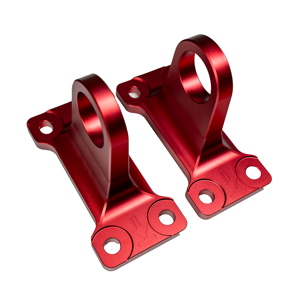 Red aluminum tow hooks for Land Rover Defender L663 90/110/130, by CT Carbon, designed as durable off-road vehicle accessories.