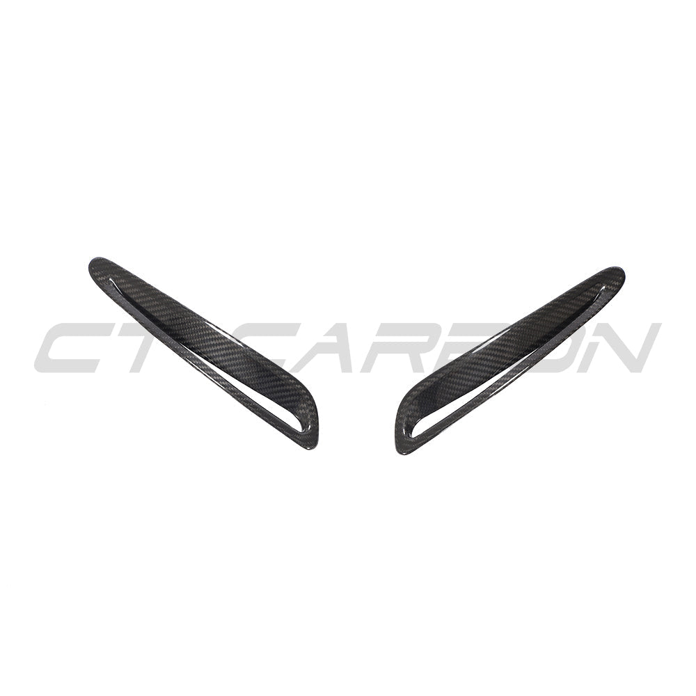 Toyota Supra 2019+ A90 carbon fiber hood trim by CT Carbon, close-up view of the sleek, lightweight accessory on the car's bonnet.