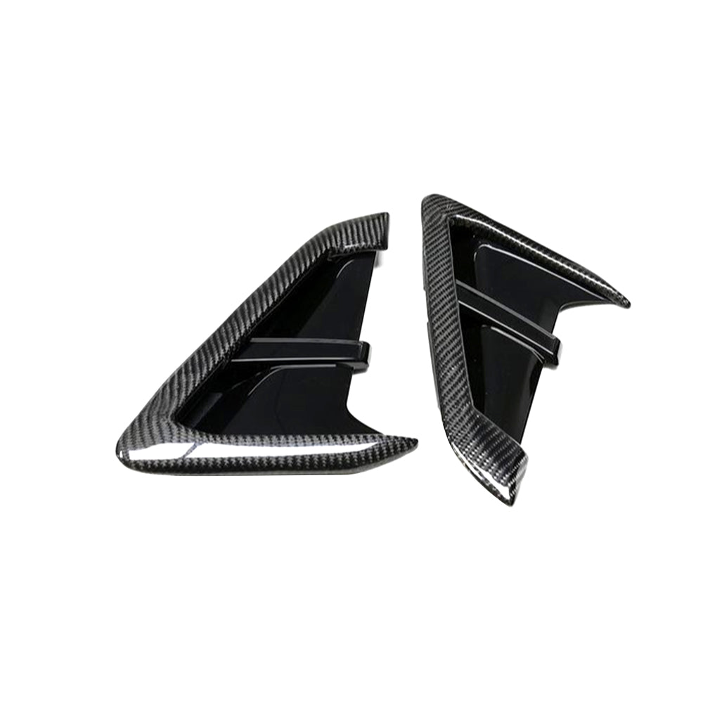 BMW G01 G02 X3 X4 F97 F98 X3M X4M carbon fibre fender trim accessory by CT Carbon, shown on vehicle fenders.