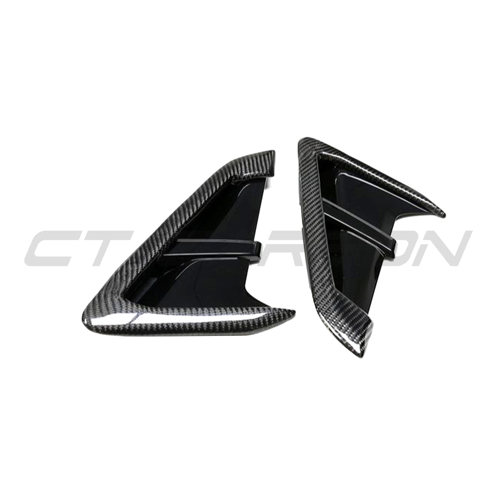 BMW G01 G02 X3 X4 F97 F98 X3M X4M carbon fiber fender trim by CT Carbon, close-up of sleek, textured automotive accessories.